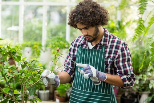 Manager reviewing garden site with clipboard